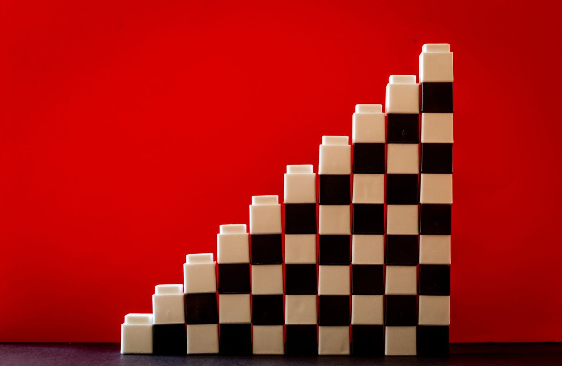 Blocks stacked into ascending steps against a red background