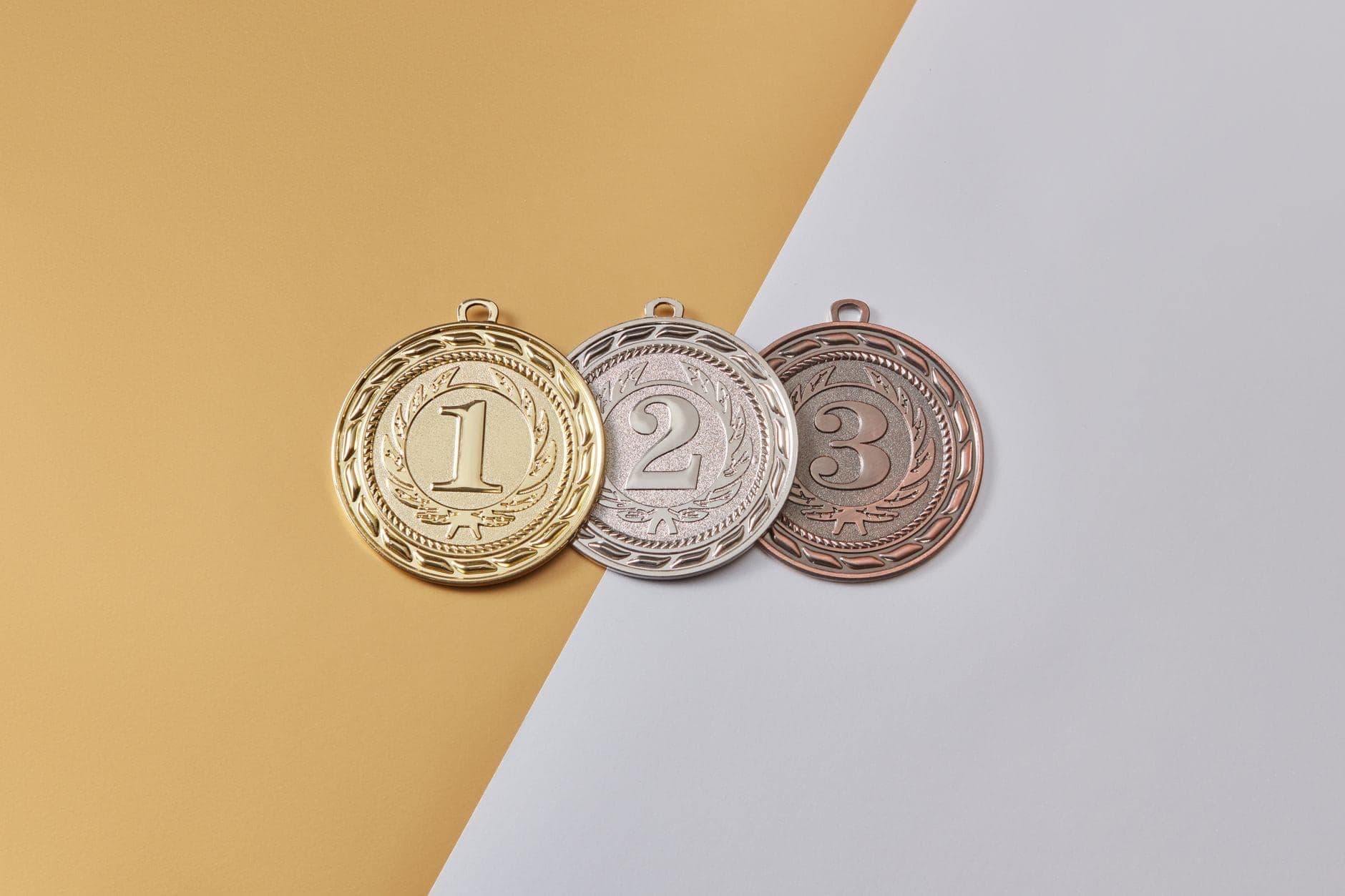 Gold, silver and bronze medals numbered one, two and three
